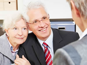 Elder Law & Medicaid Services in Jacksonville.  An older couple talking to a professional.